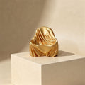 The Silhouette Seat gold silk phone holder hero