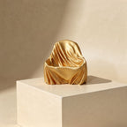 The Silhouette Seat gold silk phone holder hero